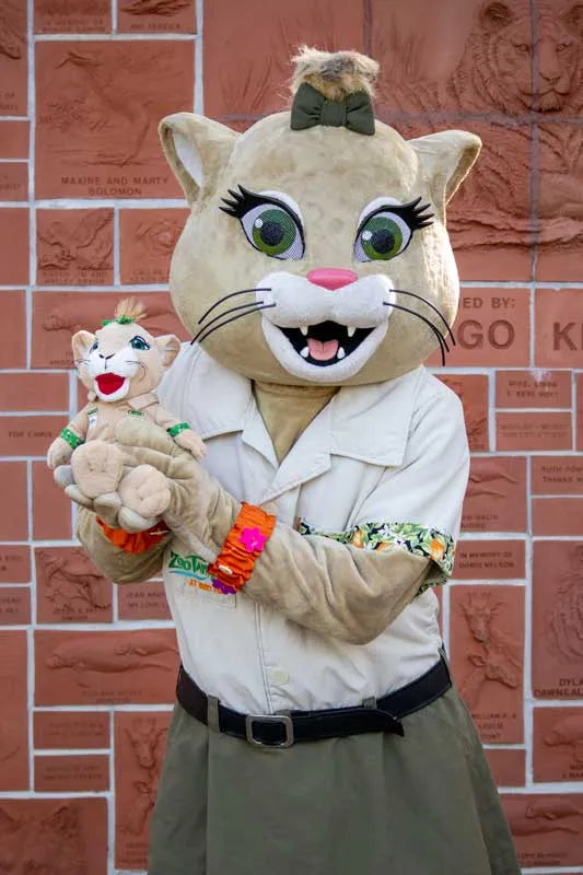ZooTampa mascot Flora the Florida Panther holding a Flora plush
